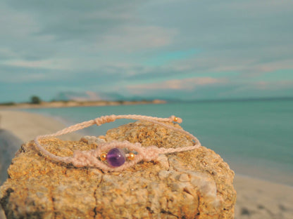 Amuleto da viaggio in macramè con pietre naturali occhio