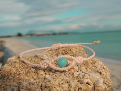 Amuleto da viaggio in macramè con pietre naturali occhio